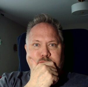 A picture of the author looking deep in thought